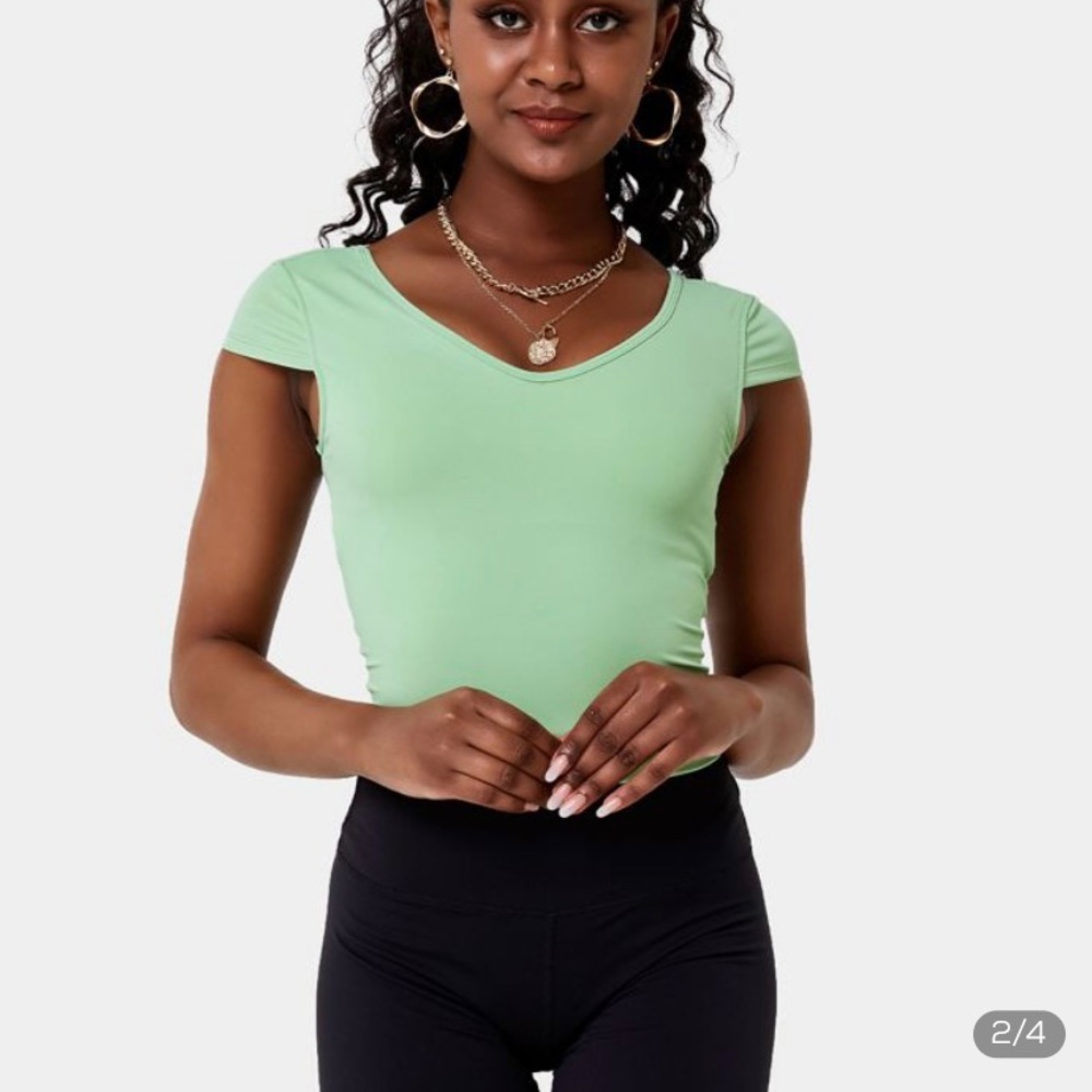 HALARA seafoam green sports top, w/ open back cut outs, fits small